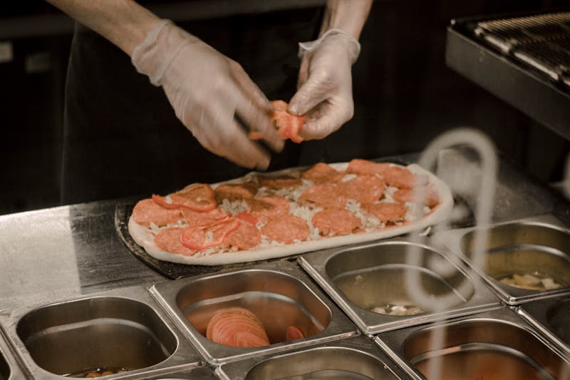 Green lantern pizza kitchen with fresh ingredients being prepared